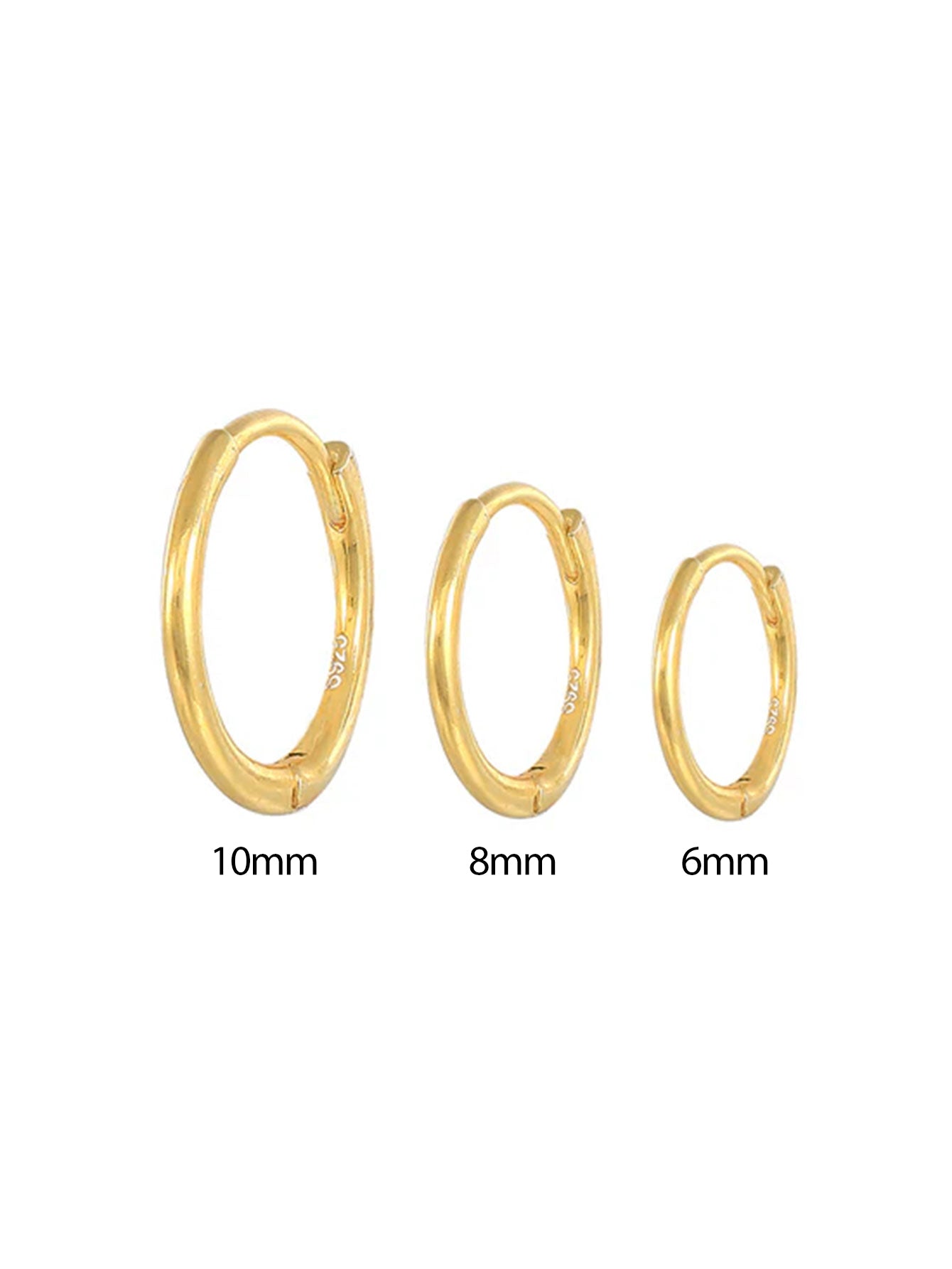 Emilie – Øreringe i fint guld med en blød glans.