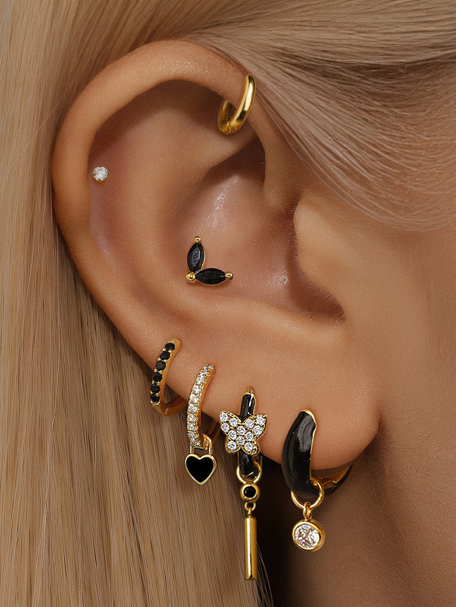 Theresia – Gyldne øreringe med blød kurvatur