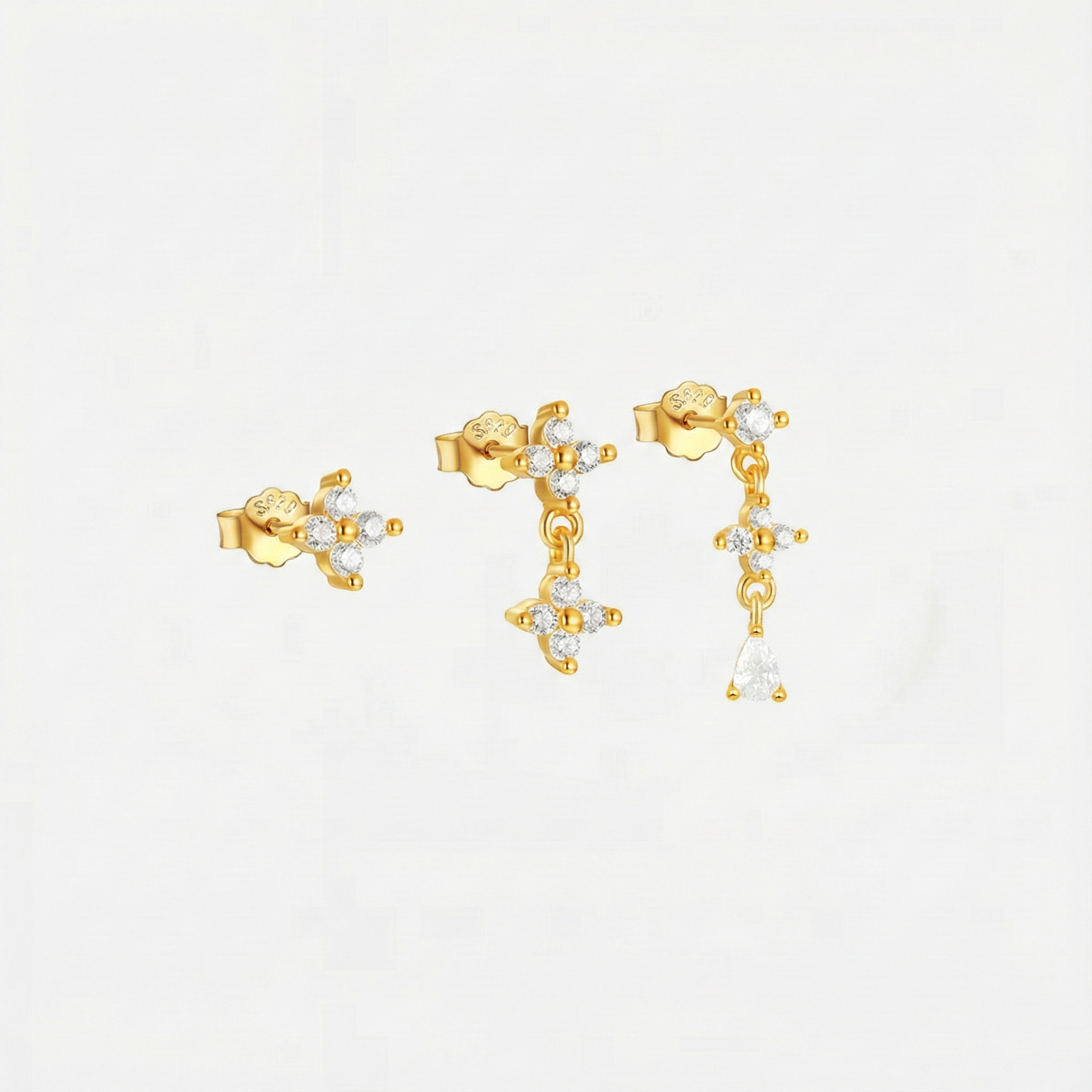 Anika – Øreringe i guld med subtil bevægelse.